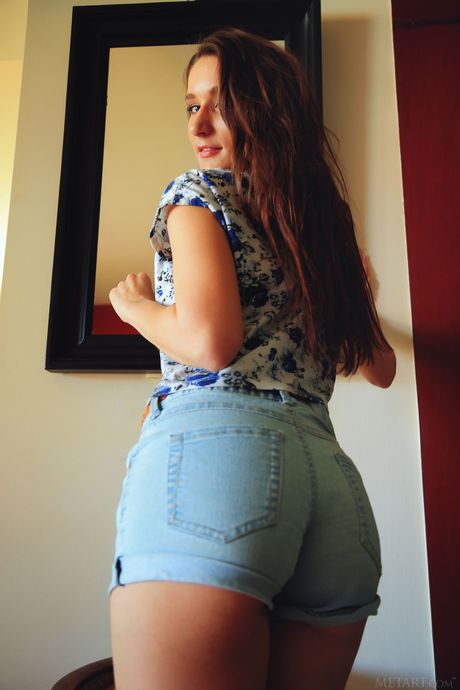 Sexy Ukrainian Elina strips and presents her big tits and ass