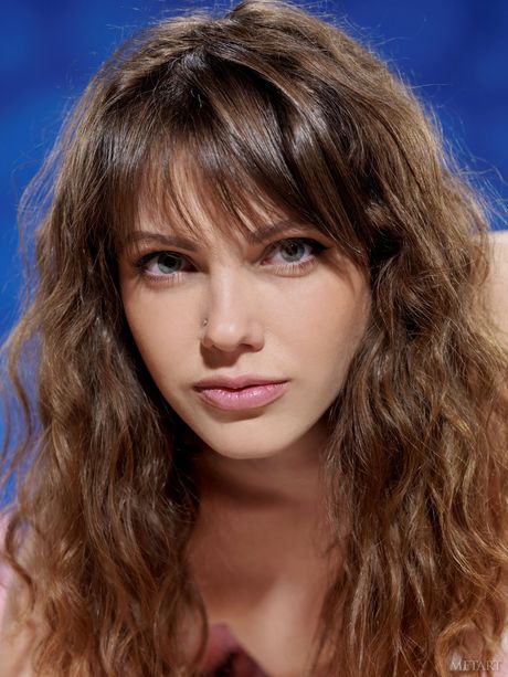 Brunette teen Inessa A removes her lingerie to pose nude