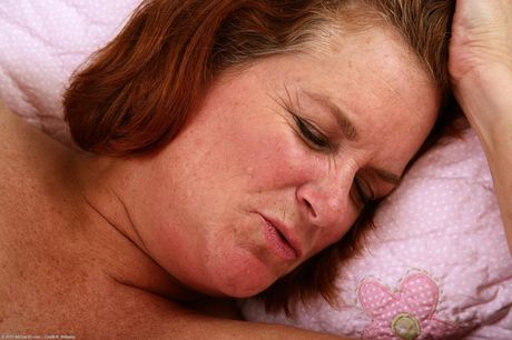 Short-haired MILF Lucy A shows off her hairy pussy up close