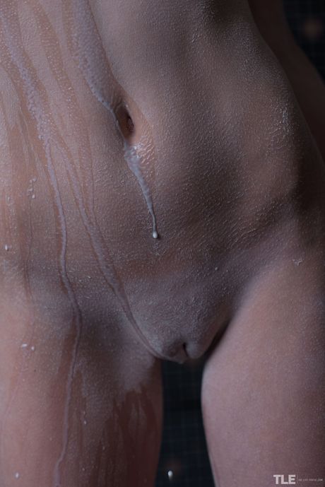 Beautiful teen Katia B gets naked in a shower while applying lotion