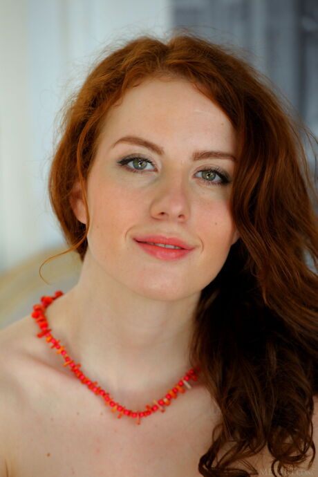 Sweet redheaded teen Sienne models totally naked confidently
