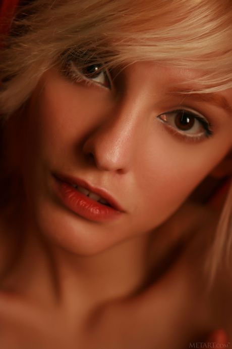 Skinny Ukrainian belle Kira W exhibits her big tits and poses naked