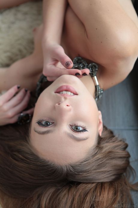 Engaging teen Valery Leche removes her dress to model naked with grace