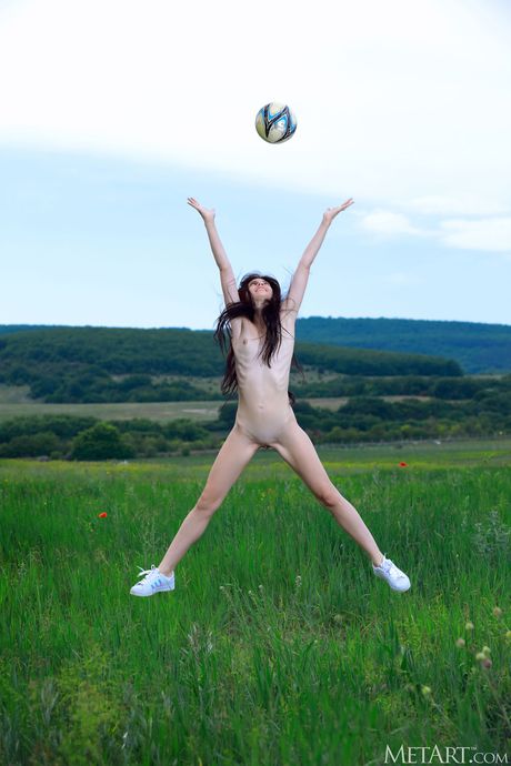 Alluring teen Aleksandrina strips naked & shows her hot body in a meadow