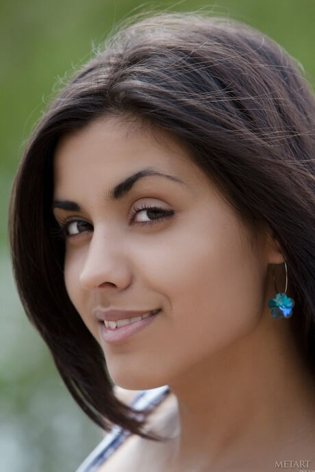 Engaging teen Belinda A strips to her high heels & demonstrates her big tits outdoors