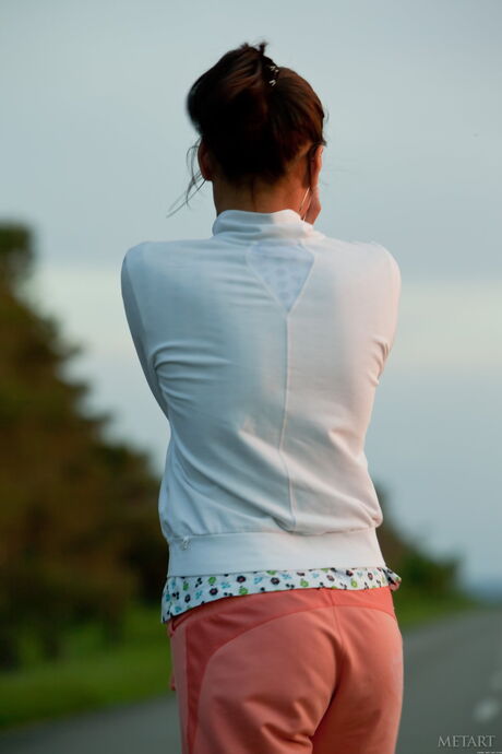 Engaging teen Belinda A strips to her high heels & demonstrates her big tits outdoors