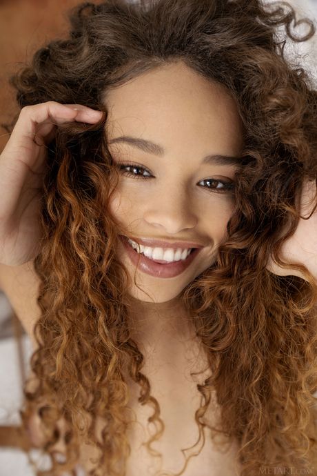 Ebony teen Cecilia Lion paints a picture of her naked body on canvas