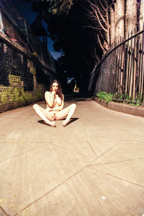 Flexible teen Samantha Bentley shows off her naked body in a backyard