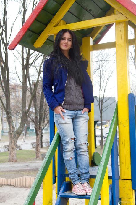 Alluring teen Malina A gets naked in a public place before showing her ass