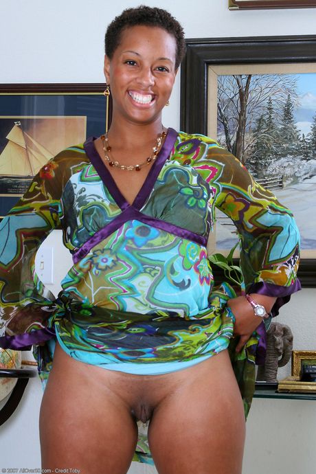 Black woman Stacy J shows her big ass and rubs her pussy in a solo