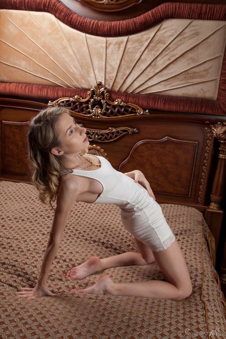 Winsome teen Olivia models totally naked temptingly by herself