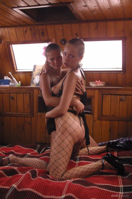 Pretty teen lesbians Ashanti A & Koika hump each other in black pantyhose