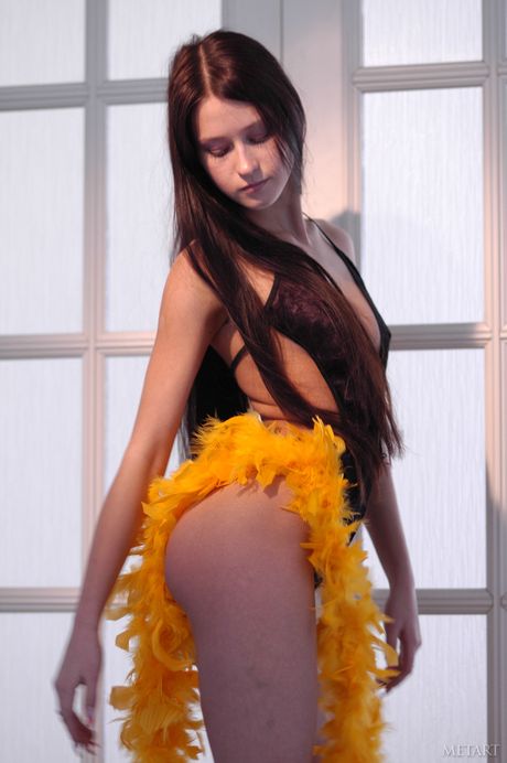 Svelte teen Masha C gets naked in a pair of black boots