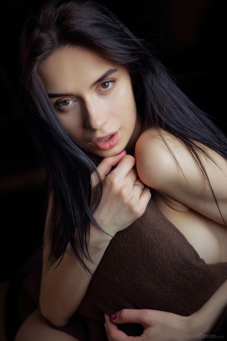 Innocent teen Dita V models totally naked on a bed with self-assuredness