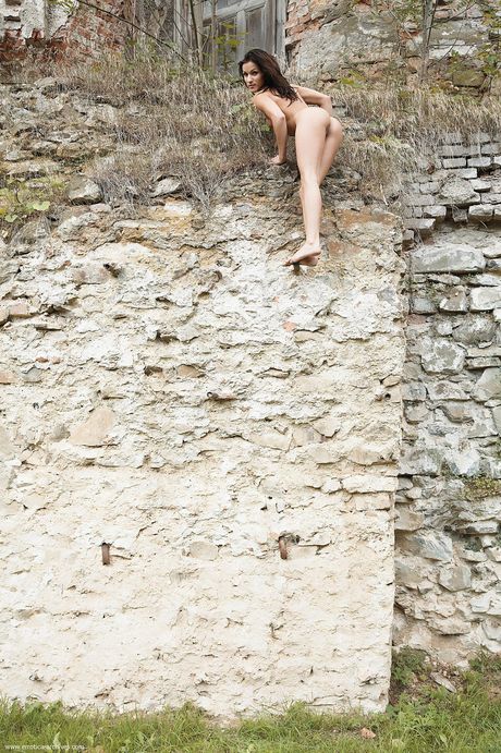 Lean teen Stephanie posing nude in the garden and on the balcony