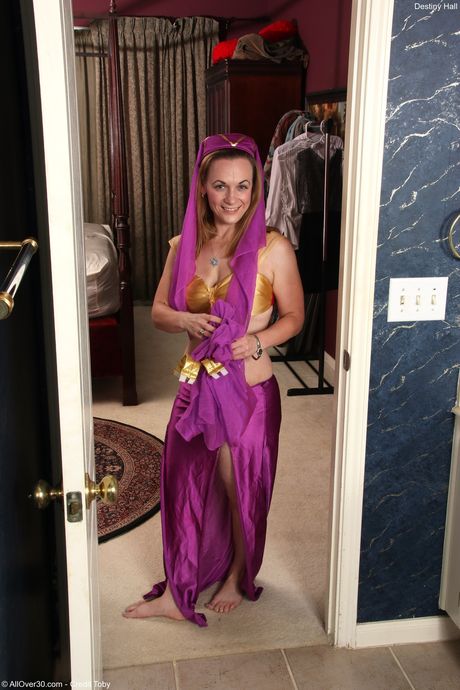 Redheaded chubby Destiny Hall strips and shows her big booty and tits