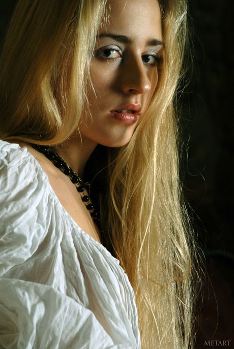 Ukrainian beautiful Vera E strips and poses naked in front of the camera