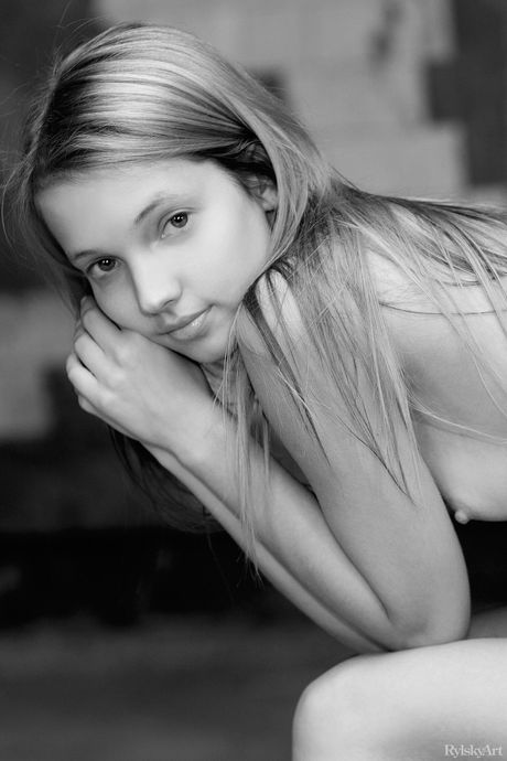 Slender teen Goldie shows off her tiny tits and ass in the nude