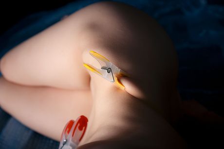 Skinny brunette Marlyn clamps her nipples and clit before masturbating