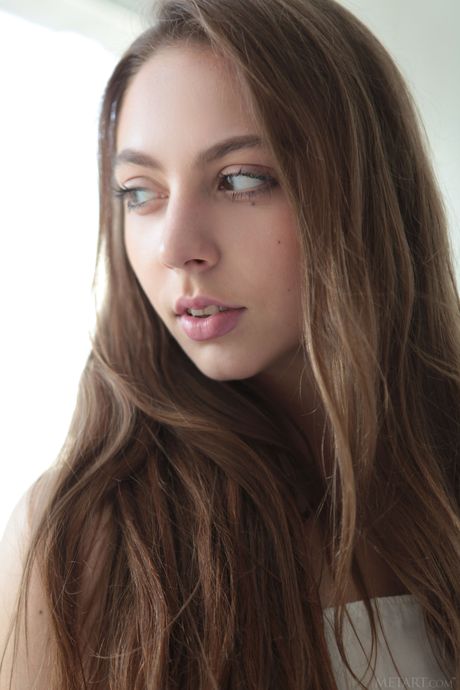 Delicate teen Valery Leche shows her small tits and poses naked