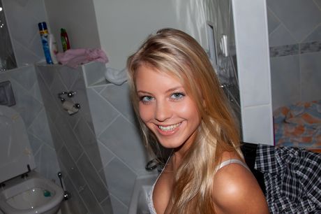 Young beauty Barbara D gets naked in a bathroom while wearing a tiara