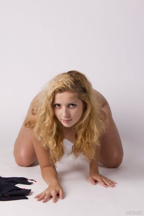 Ukrainian beautiful Tofana A removes her lingerie to pose nude