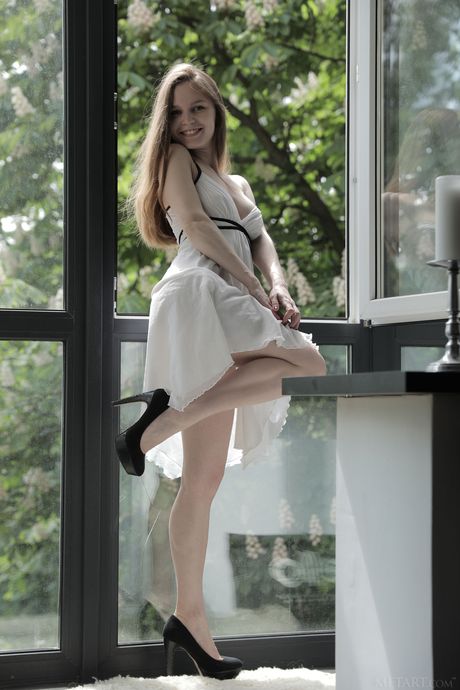 Ukrainian lovely Sofi Shane gets naked seductively on her bed