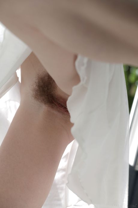 Ukrainian lovely Sofi Shane gets naked seductively on her bed