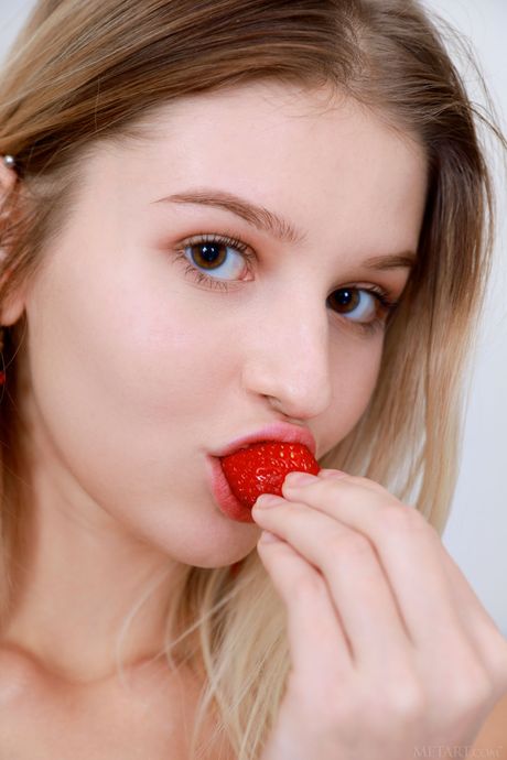 Skinny blonde teen Libby gets naked in a kitchen while cooking