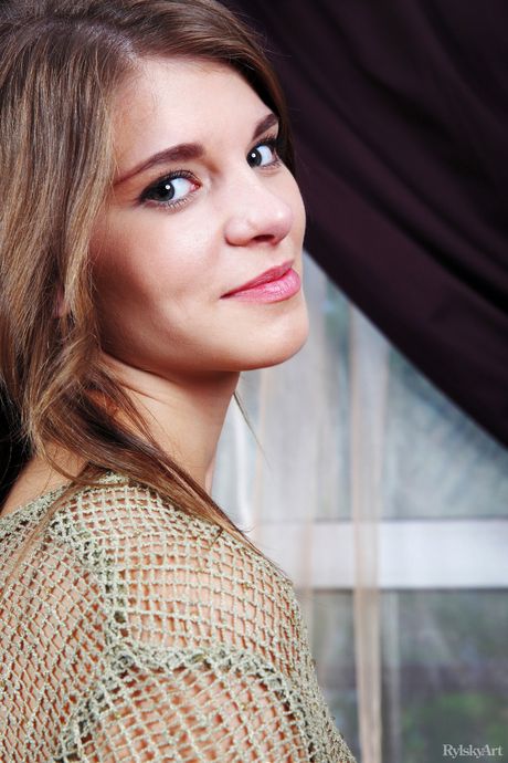 Adorable teen Berka shows her tiny tits and poses naked in a solo shoot