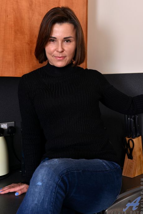 Blonde housewife Jamie Ray shows her big tits and shaved pussy in the kitchen