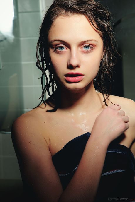 Young brunette Clarice A fingers her pussy while taking a shower