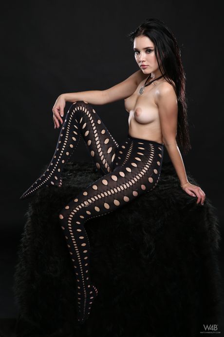 Lovely teen Malena removes a pair of sexy pantyhose to get totally naked