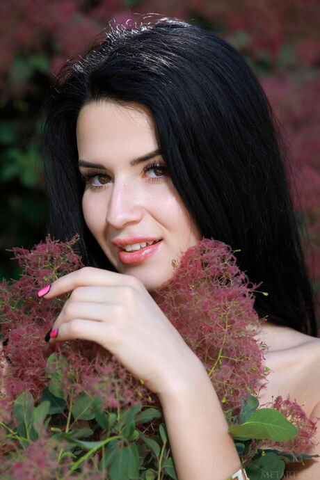 Sexy Ukrainian Lola Marron reveals her big tits and poses naked in nature