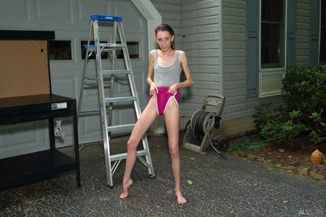 Delicate teen Aria Haze takes it all off on a workbench out in a driveway