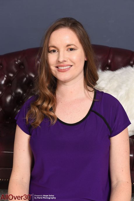 Chubby MILF Hope Soloz toys her trimmed pussy after getting naked