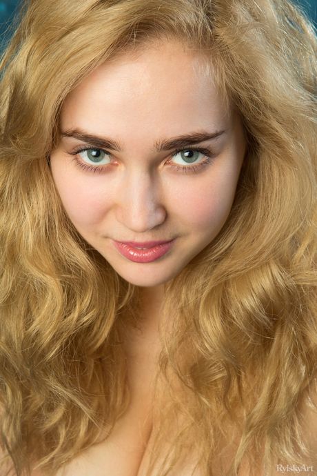 Young blonde Theodora goes naked with certainty