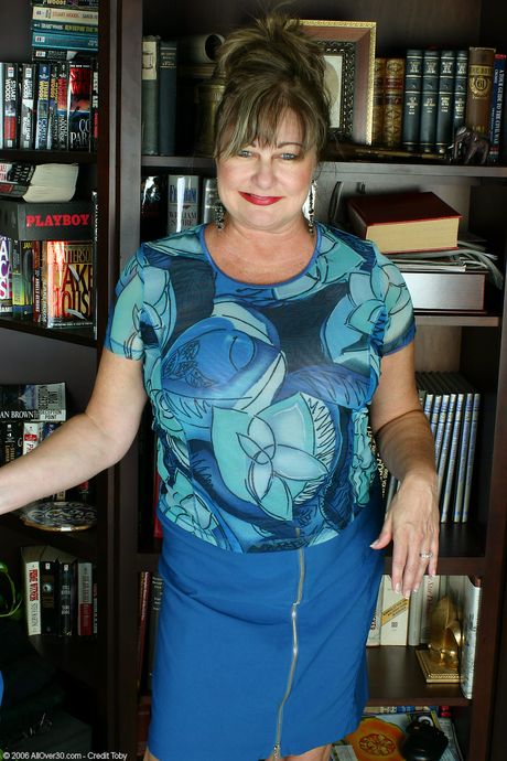 Chubby mature Ruby shows her big tits and fat ass before masturbating