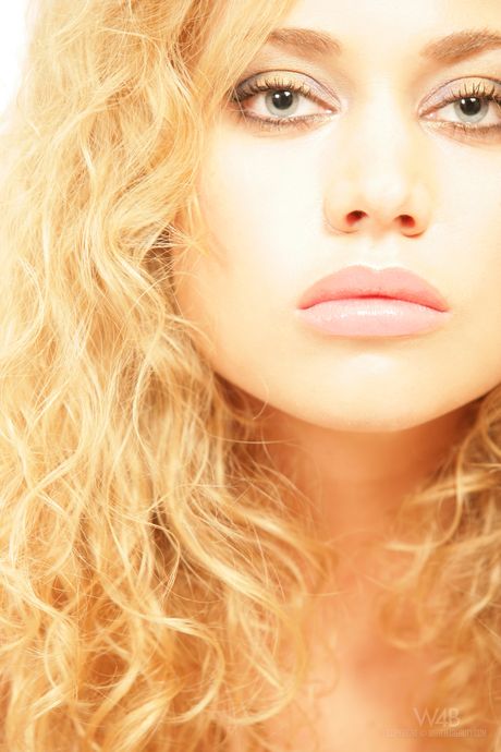 Glamorous teen Olga poses in her sexy lingerie and strips to show her pussy