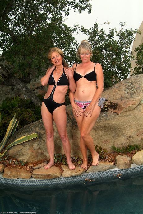 Amateur MILFs Tina & Janet L show their tanned bodies and hairy pussies outdoors