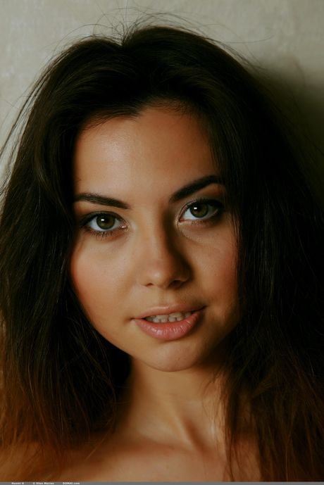 Cute teen Naomi G bares herself on a chair confidently