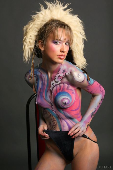 Russian babe Natalia B gets naked sensually on a bed