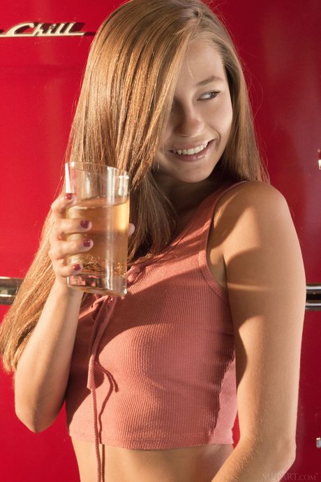 Bashful teen Carolina Sweets removes her underwear to pose nude