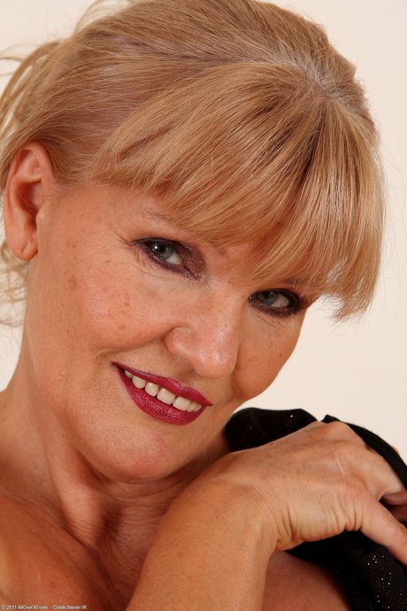 Blonde mature Lena F shows her big ass and rubs her pussy in a solo