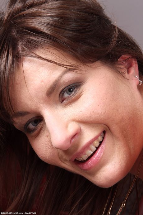 Mature brunette Sophia M unveils her big tits and toys her hairy cunt