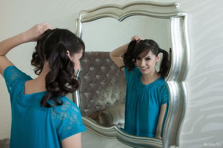 Nice teen Swan removes her pigtails while getting totally naked on her bed