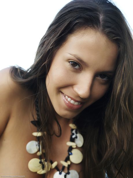 Stunning teen Avia models totally naked while in a swimming pool