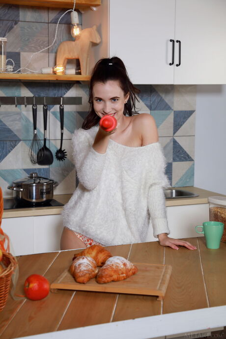 Lovely teen Velana removes her lingerie and heels to get naked in the kitchen