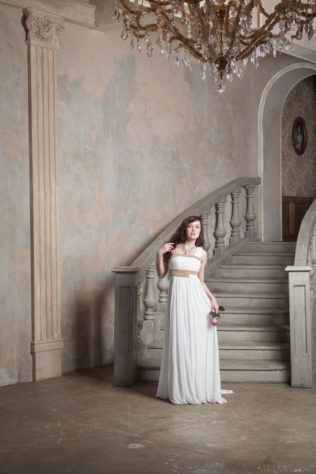 Gorgeous teen Ulia removes her white dress to model in the nude