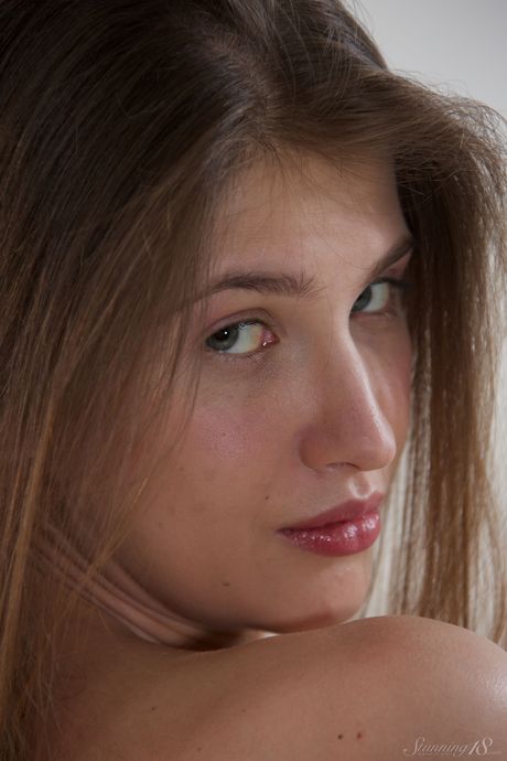 Lovely teen Cheeta highlights her hairless pussy after getting naked